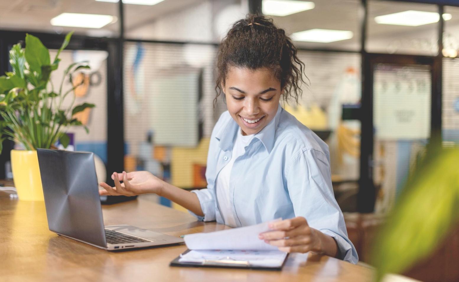 Trading psychology workspace with books and research materials